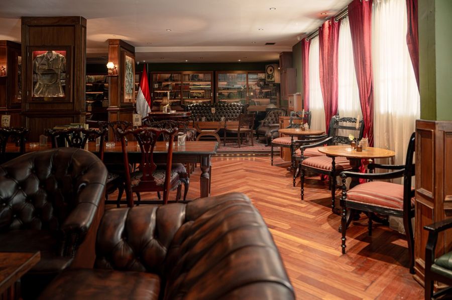 Colonial jazz bar interior with reclaimed teak furniture at The Gunslinger's Hop, Kebayoran Baru Jakarta