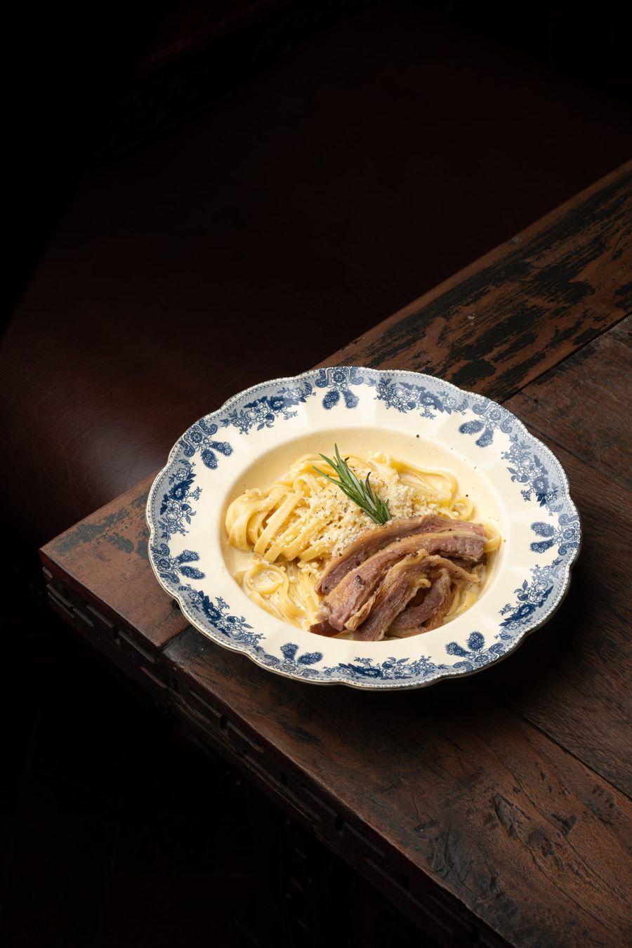 Cocktail bar counter and spirit collection at The Gunslinger's Hop jazz bar Jakarta