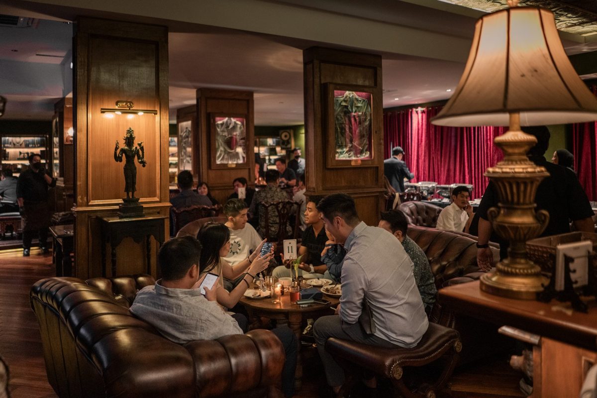 Colonial jazz bar interior — guests seated at The Gunslinger's Hop, Kebayoran Baru Jakarta